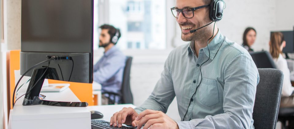 Smiling,Handsome,Male,Customer,Support,Phone,Operator,With,Headset,Working
